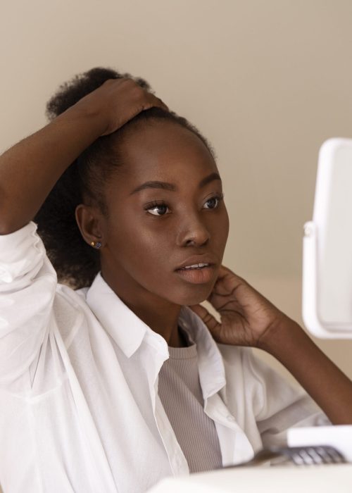 side-view-woman-styling-hair